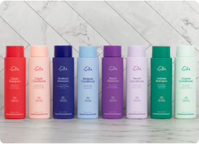 Flaconi di shampoo eSalon allineati in fila.